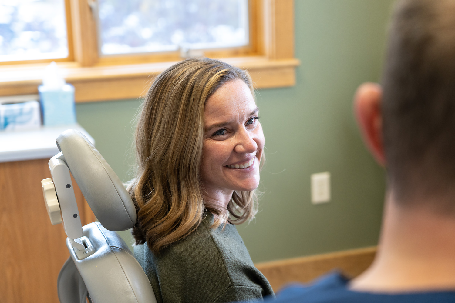 shine dental patient smiling talking to the doctor