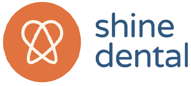 Logo for Shine Dental featuring a white heart-shaped design in an orange circle with the words "shine dental" in blue.