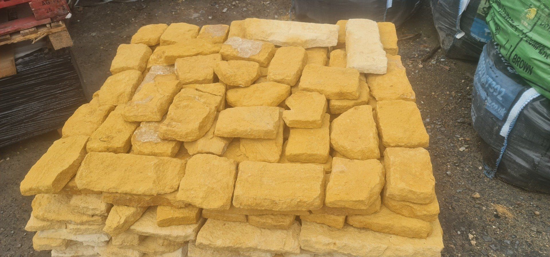 Stack of yellow rectangular stones.