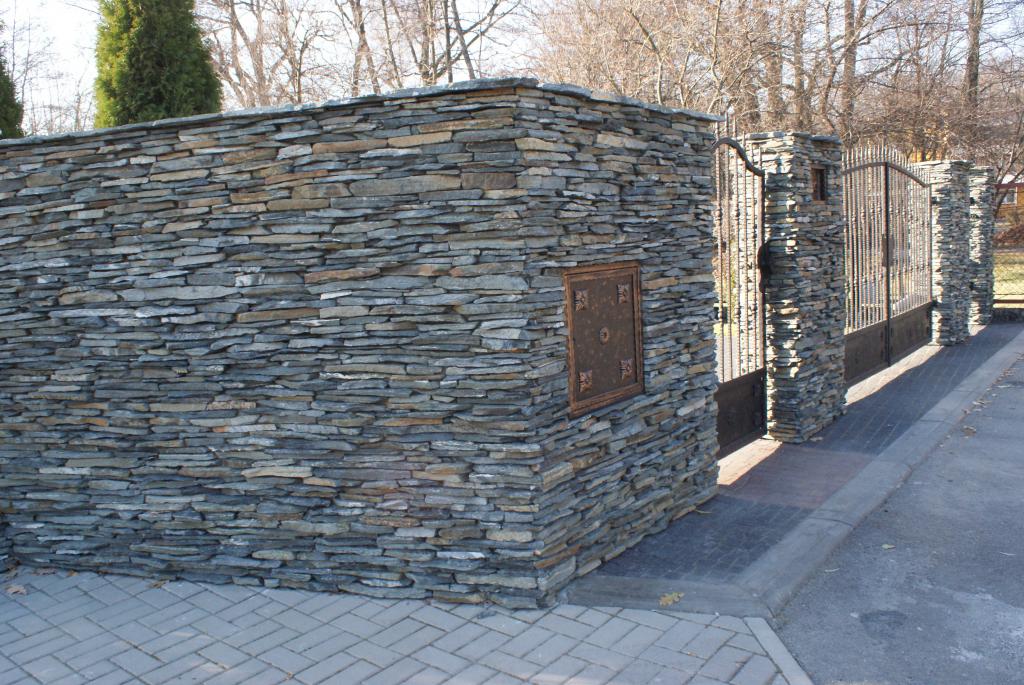 Stone wall with gate and pathway.