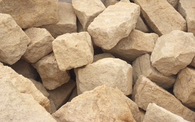Pile of rough, beige-colored rocks.