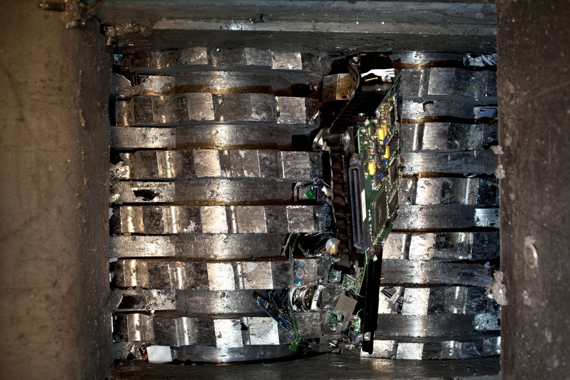 A close up of a metal structure with a broken piece of metal in the middle