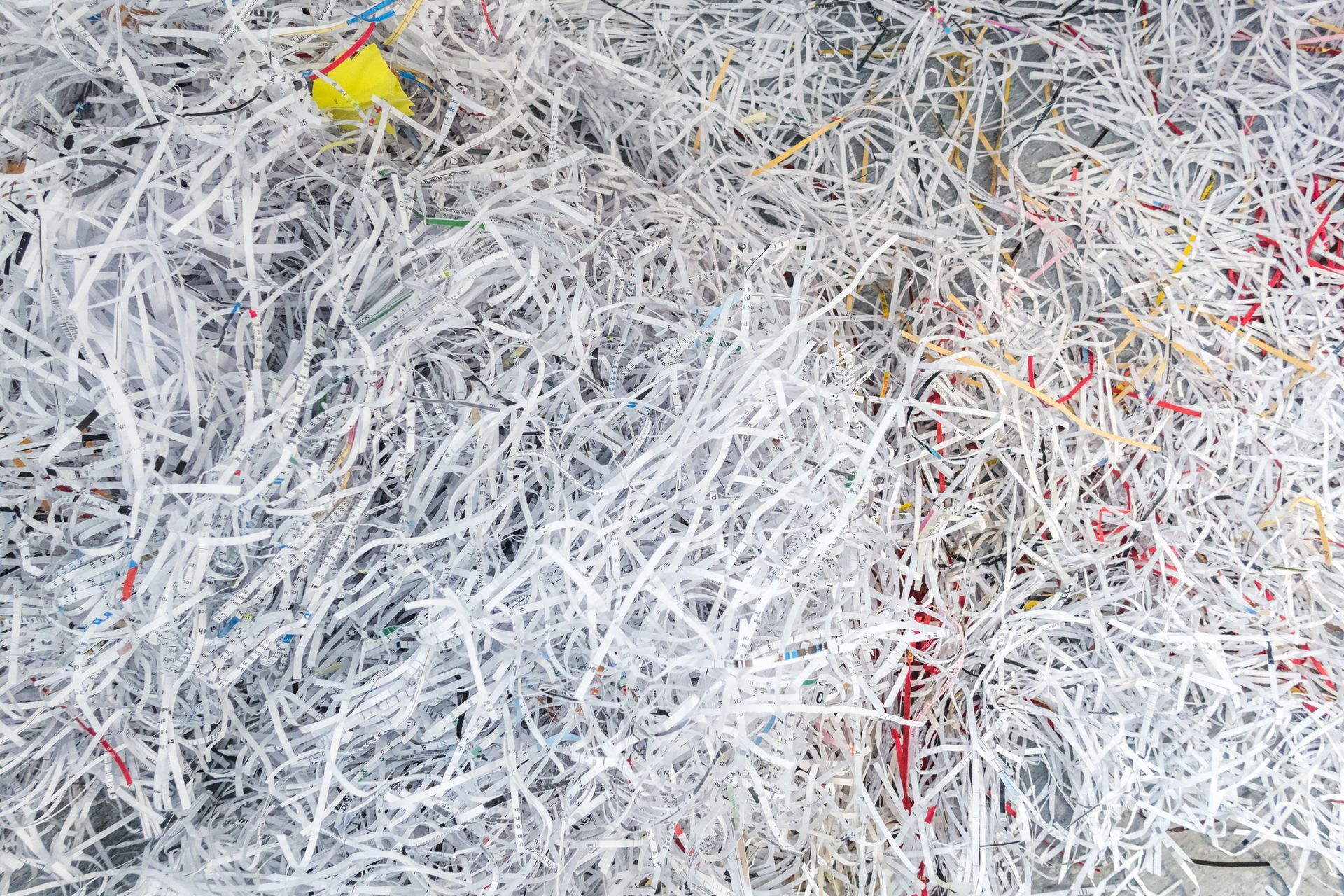A close up of a pile of shredded paper on a table.