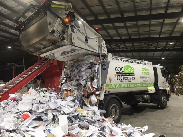 Secure document destruction and paper recycling facility processing confidential business records for secure disposal.