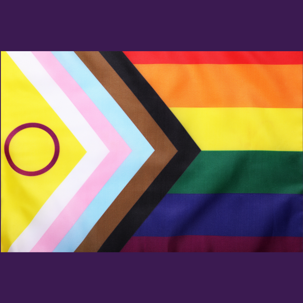 A rainbow flag with a yellow circle in the middle