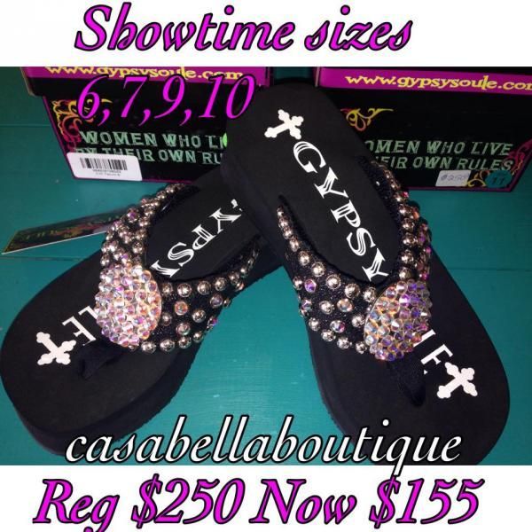 Black X-style slip-on sandals with rhinestone accents on a teal background, sale ad text included