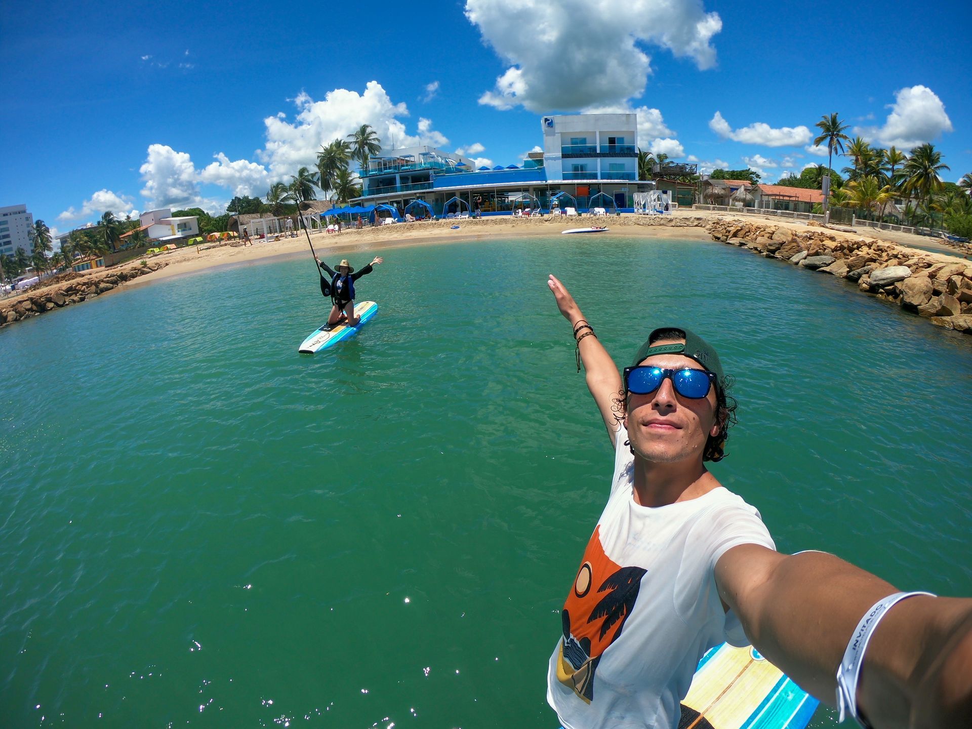 Man taking a selfie while paddle boarding in the sea during a beach tour at Hotel Poblado Coveñas