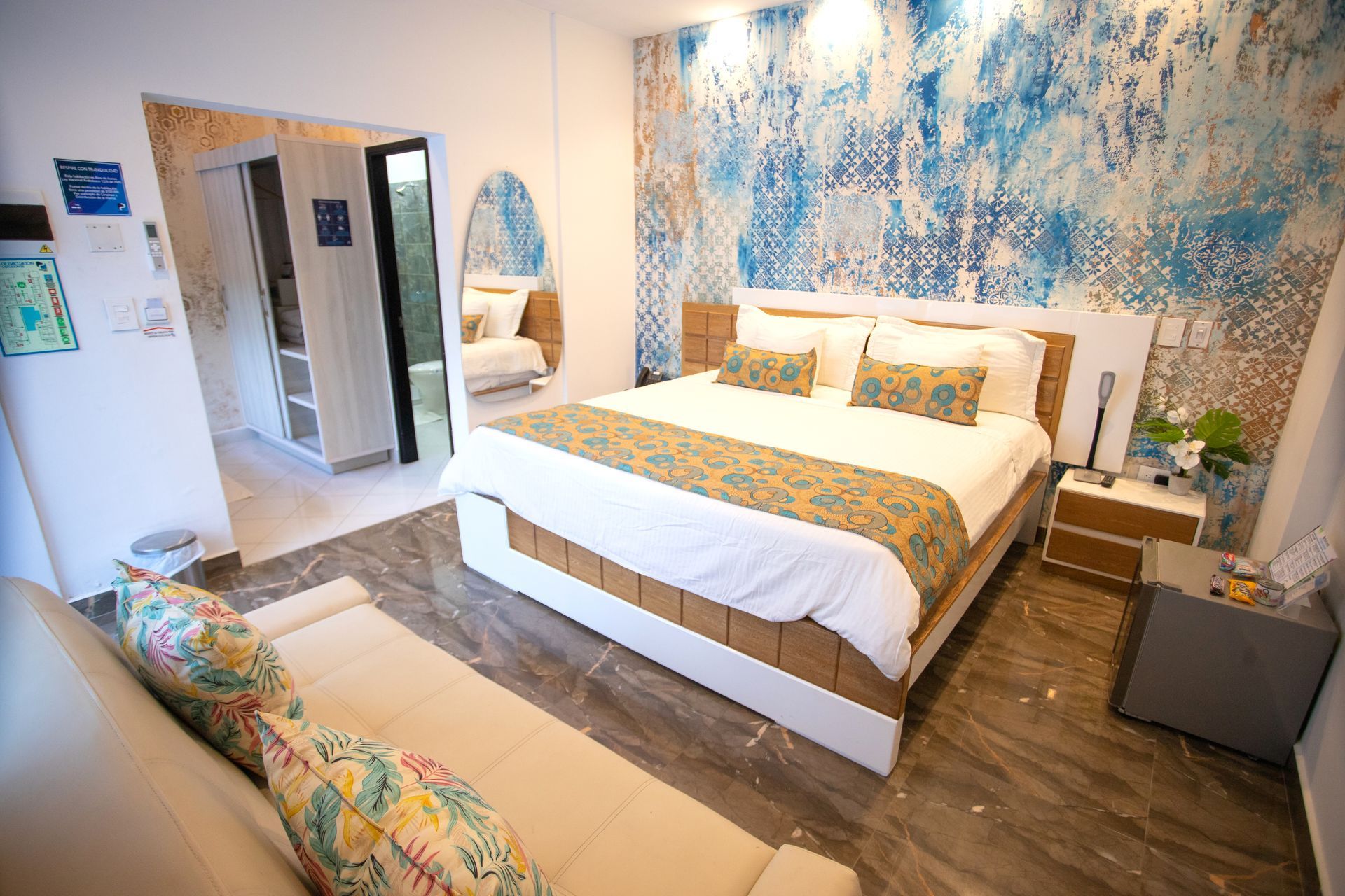 Bright hotel suite with comfortable bed and modern decor perfect for your vacation at a top beach hotel in Coveñas