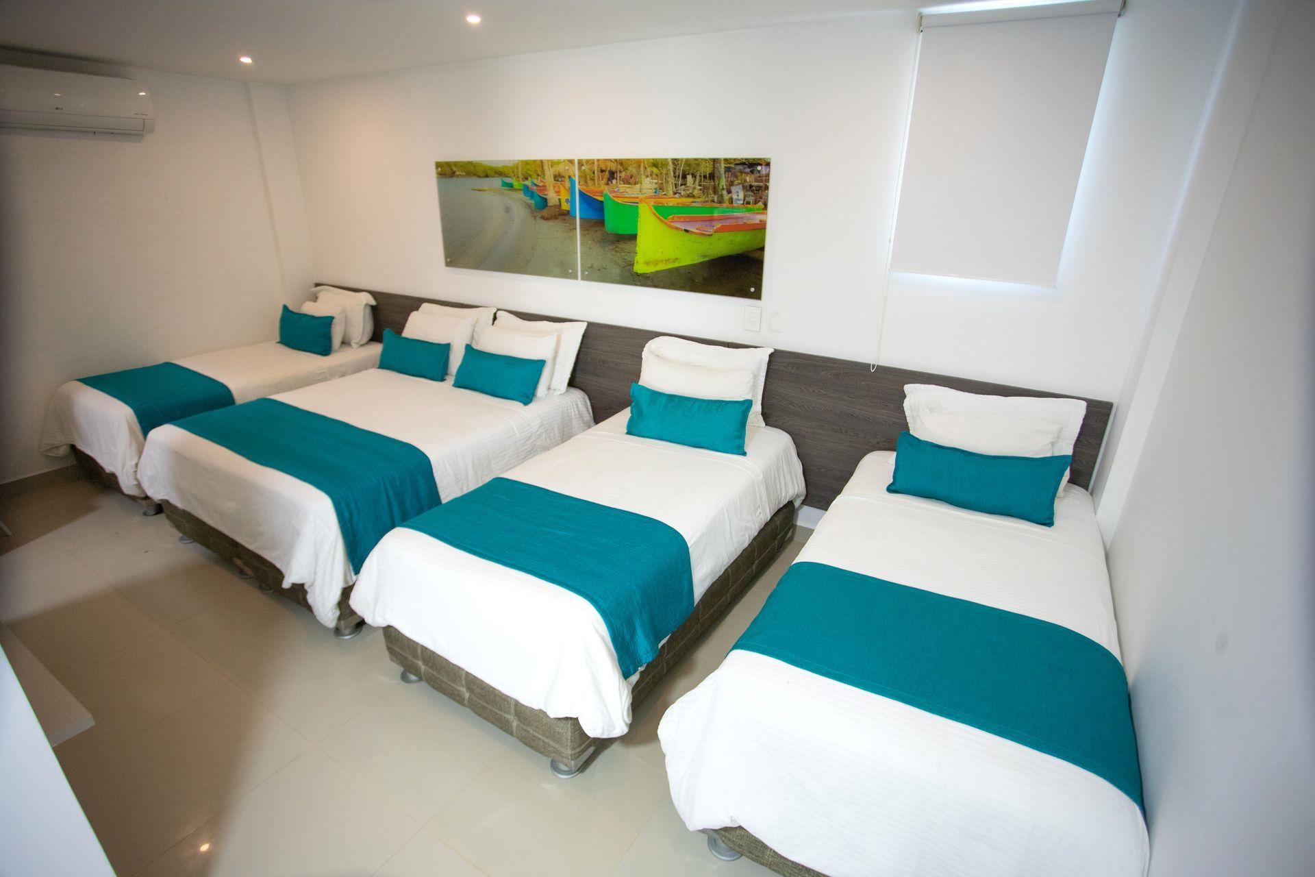Comfortable hotel room with four single beds for your group trip at a top beach hotel in Coveñas Colombia