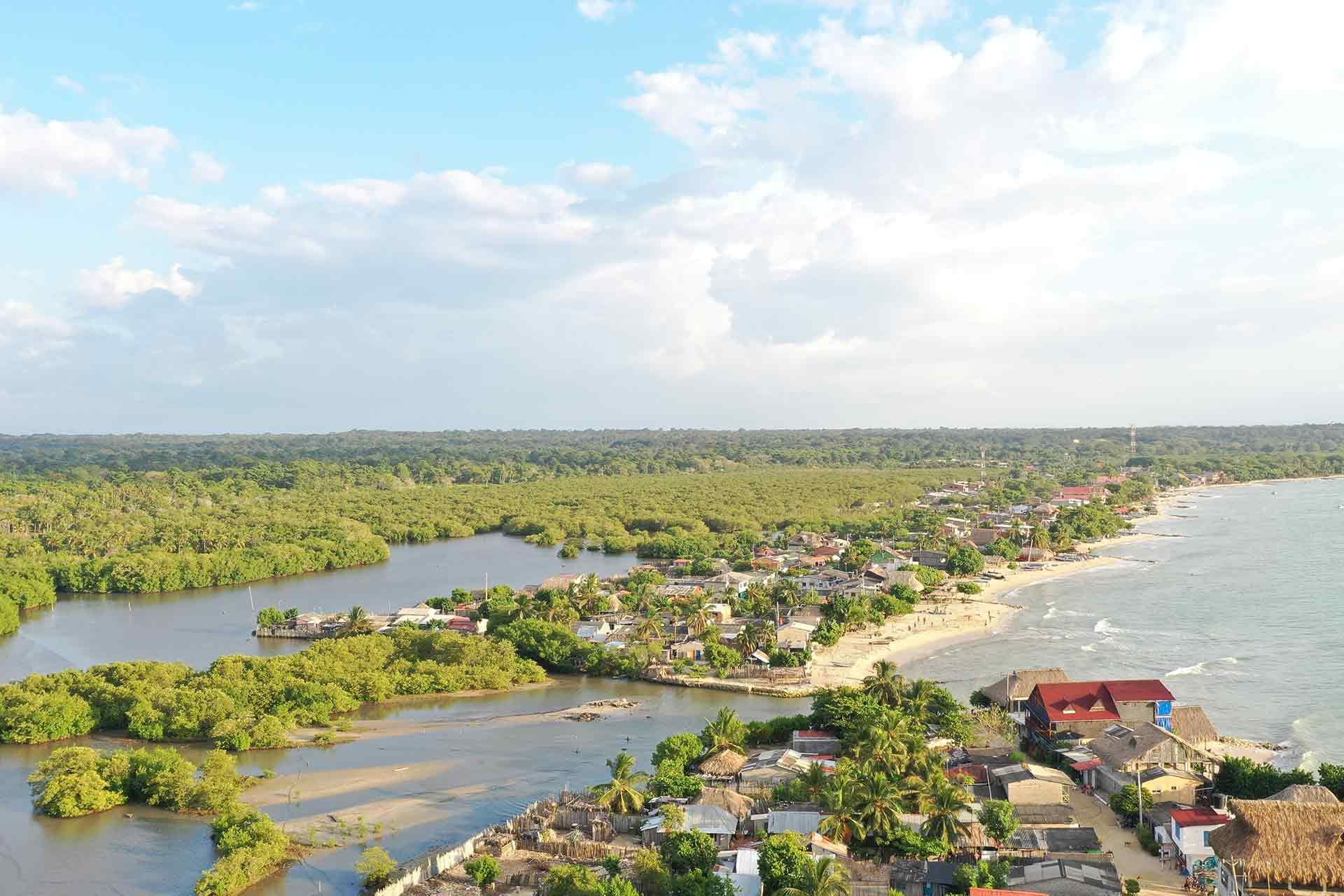 Aerial view of green mangroves and coastal beaches for planning activities in the Islas de San Bernardo Colombia