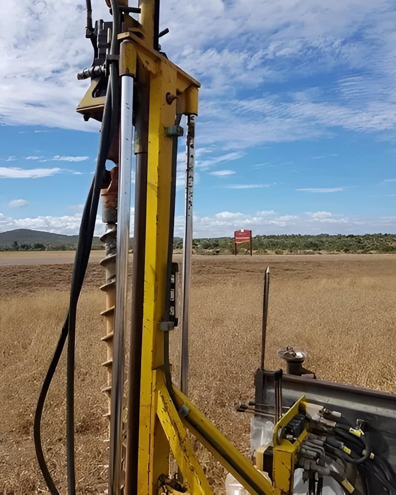 A Yellow Drill Is Sitting In The Middle Of A Field — PGI North QLD In Rosslea, QLD