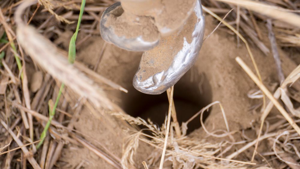 A Close Up Of A Drill Bit In The Dirt — PGI North QLD In Rosslea, QLD