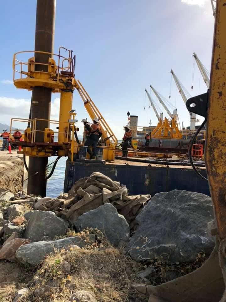 A Group Of Construction Workers Are Working — PGI North QLD In Rosslea, QLD