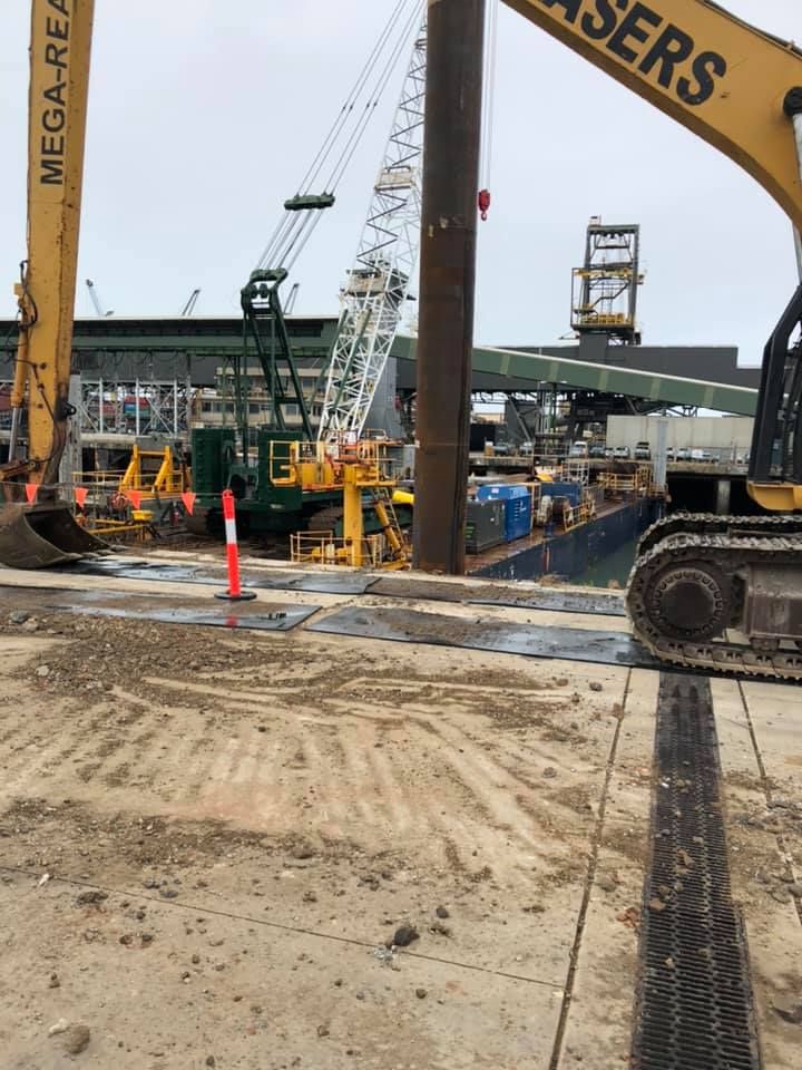 A Construction Site With An Excavator In The Foreground — PGI North QLD In Rosslea, QLD