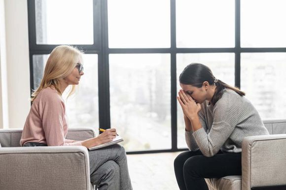 Girl having a discussion with psychologist's