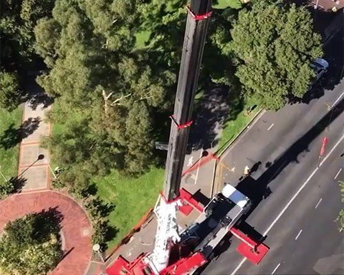 Red Crane in Action — Adelaide, SA — AGL & Son Crane Hire