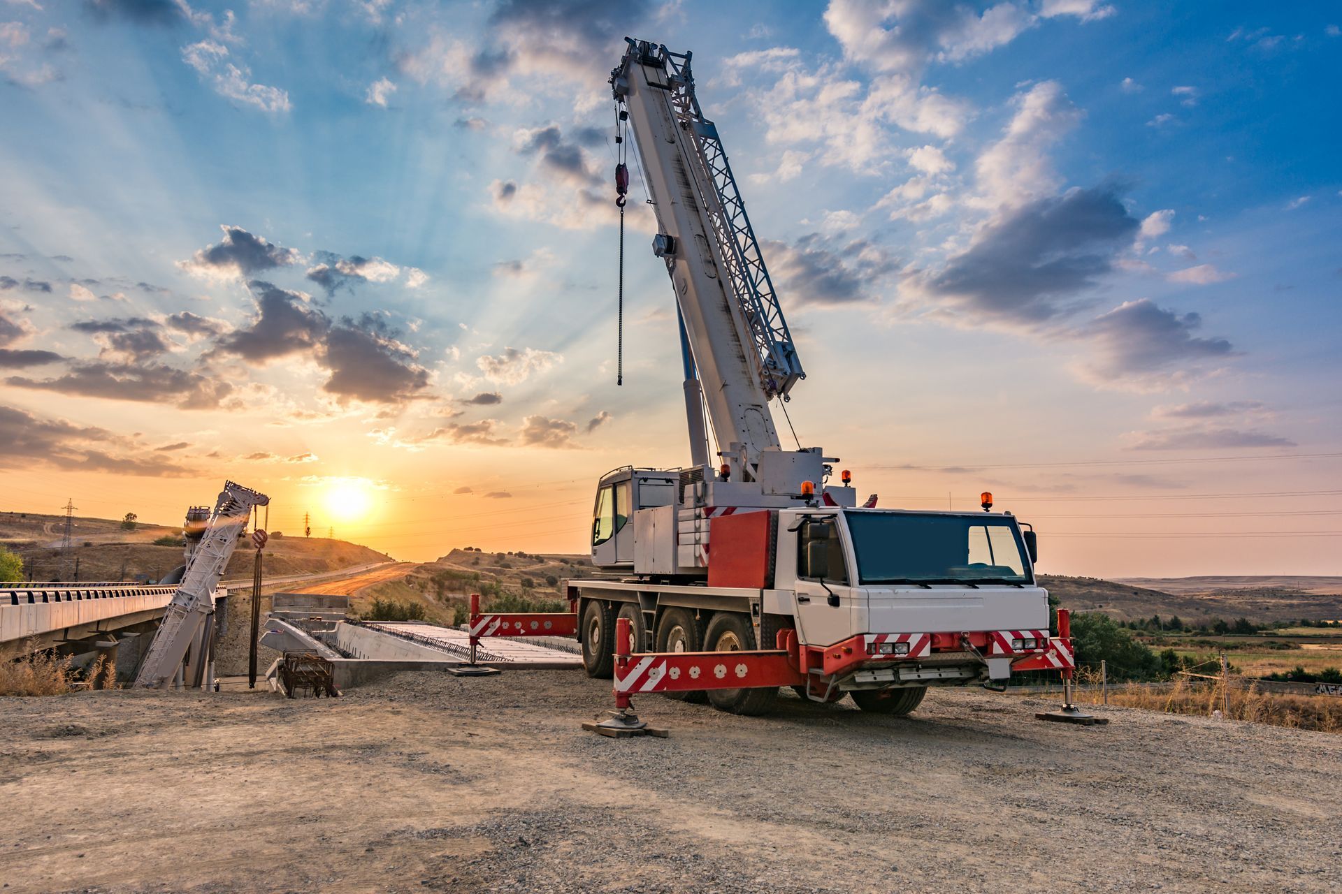 A crane truck in the construction of a bridge.