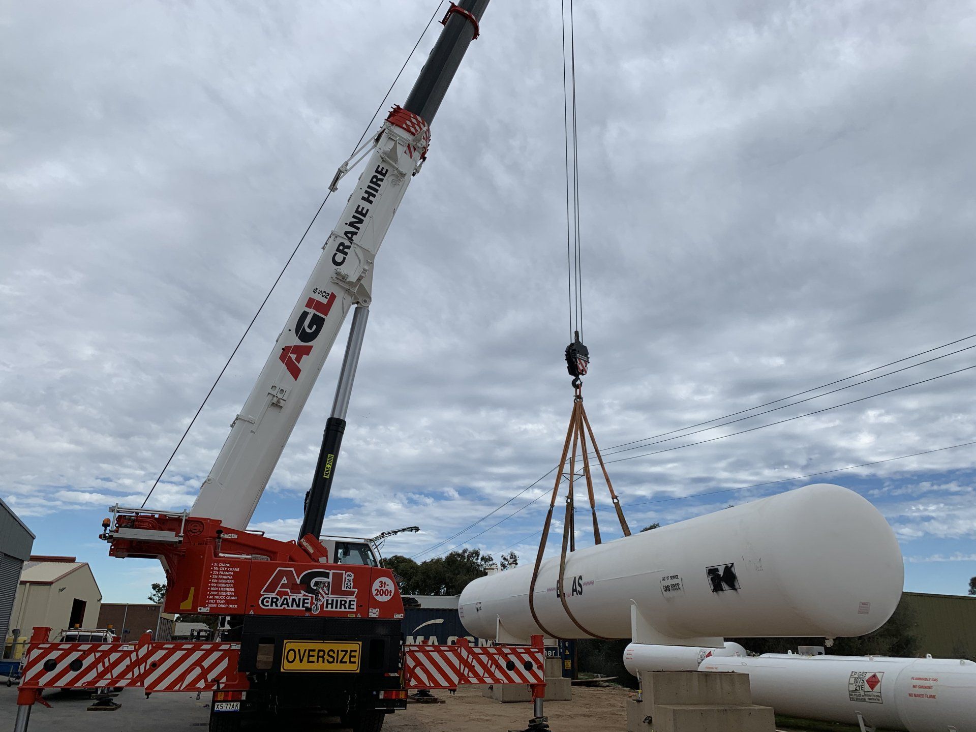 Workers Moving Gas Cylinder Different Angle — Adelaide, SA — AGL & Son Crane Hire