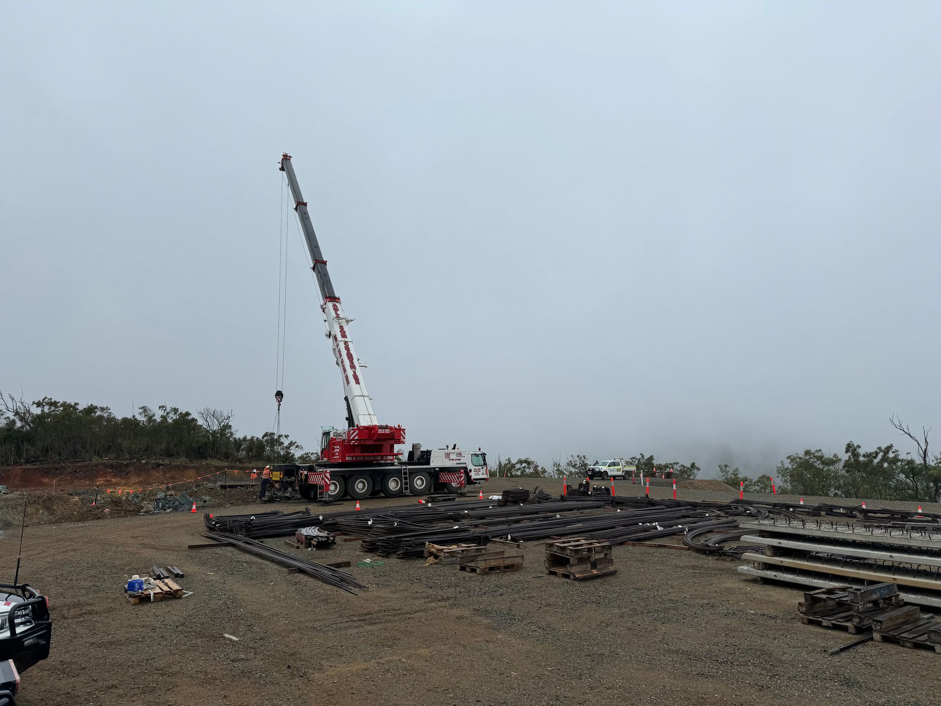 A large crane is sitting in the middle of a field | AGL & Son