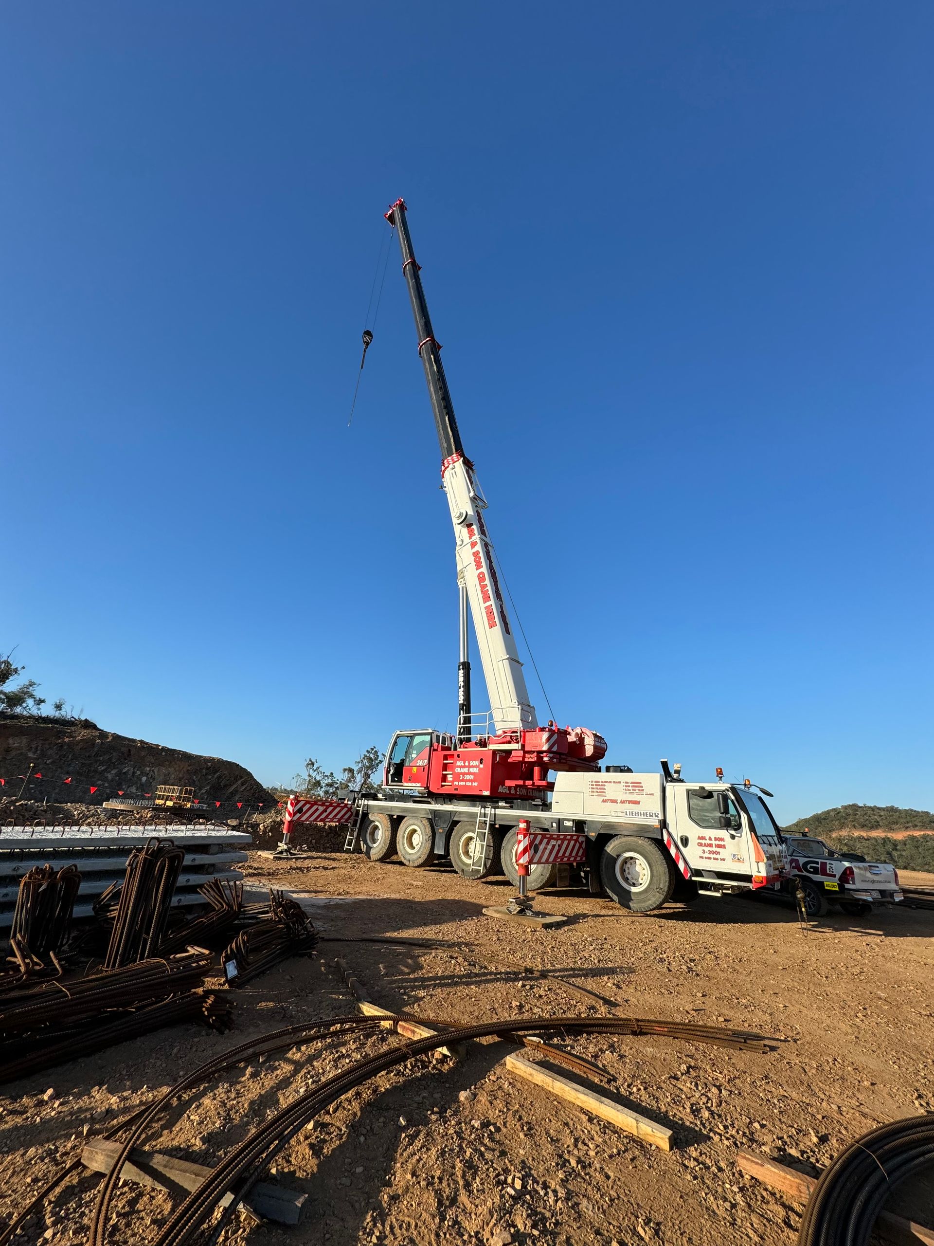 A large crane is sitting in the middle of a field | AGL & Son