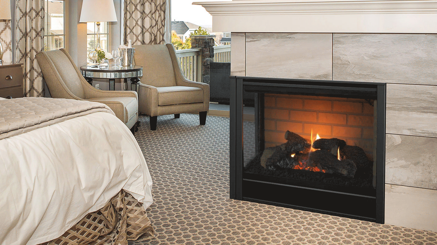 A bedroom with a fireplace and a bed