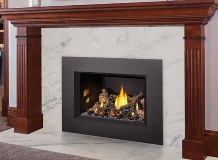 A fireplace with a wooden mantle in a living room