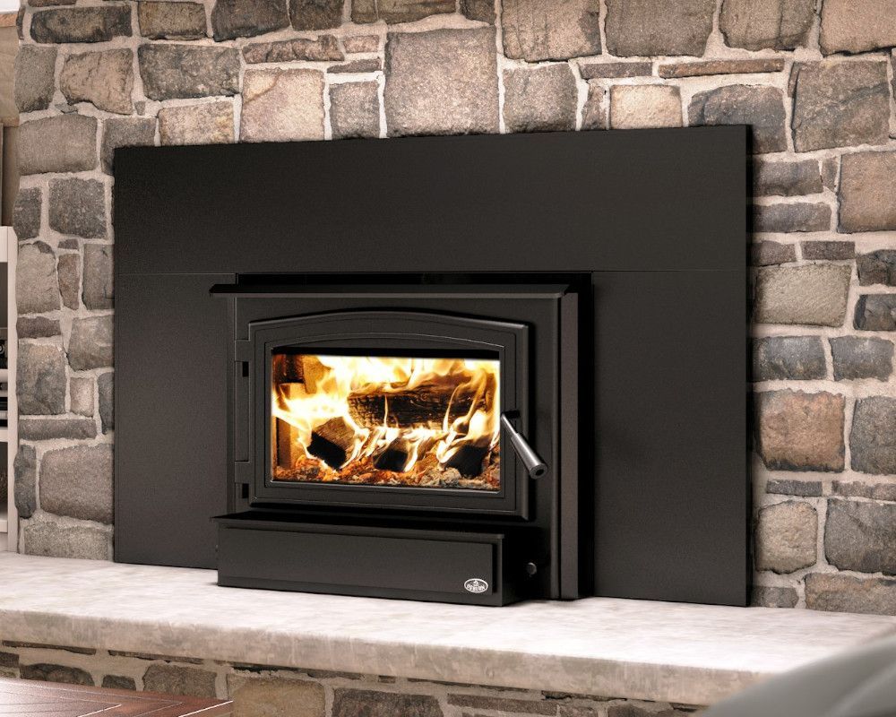 There is a fireplace with a wood stove in it.