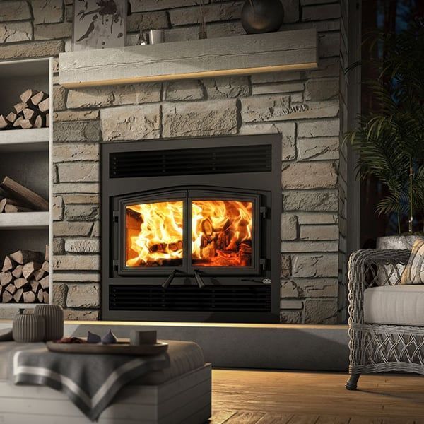 A living room with a fireplace and a couch