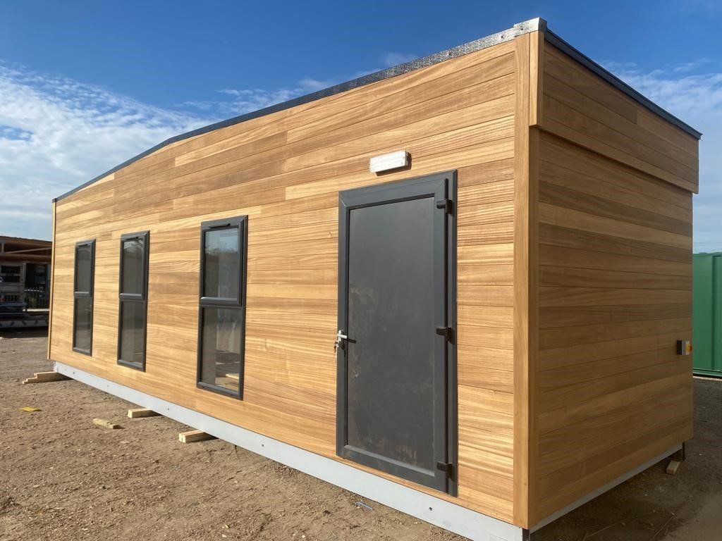 A small wooden building, serving as a marketing suite