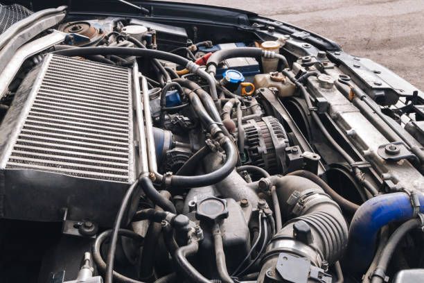 man repairing engine car