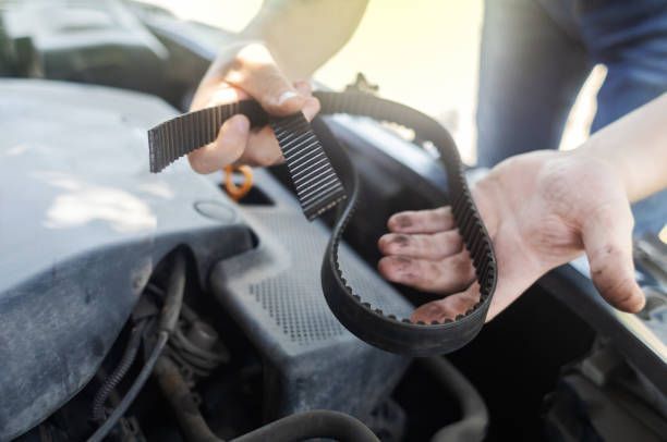man repairing engine car