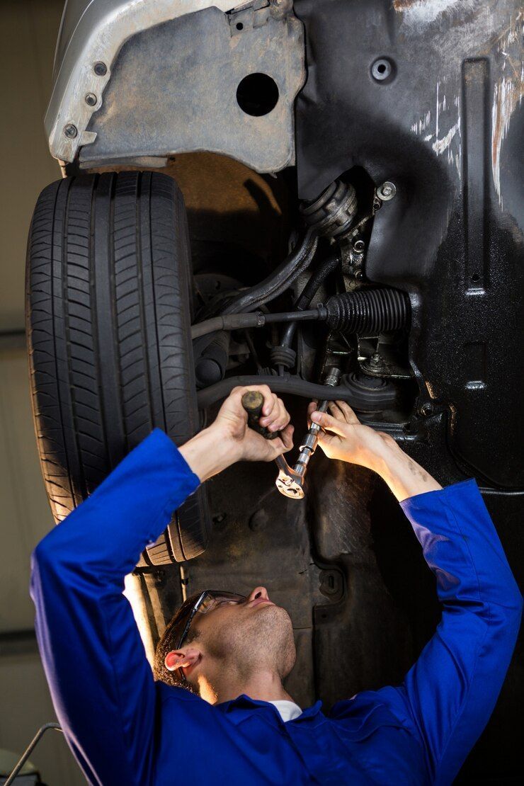 A person is pouring oil into a car engine.
