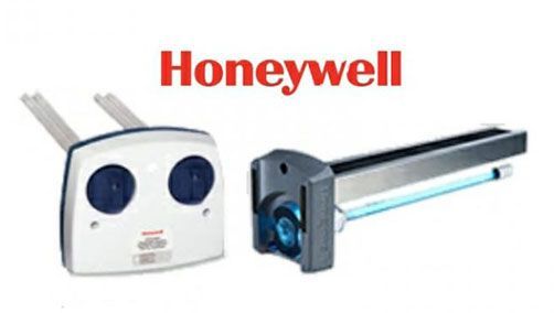 Honeywell air purifier systems with red logo. One on left is white with two dark blue circles. Other on right has a light blue UV tube.