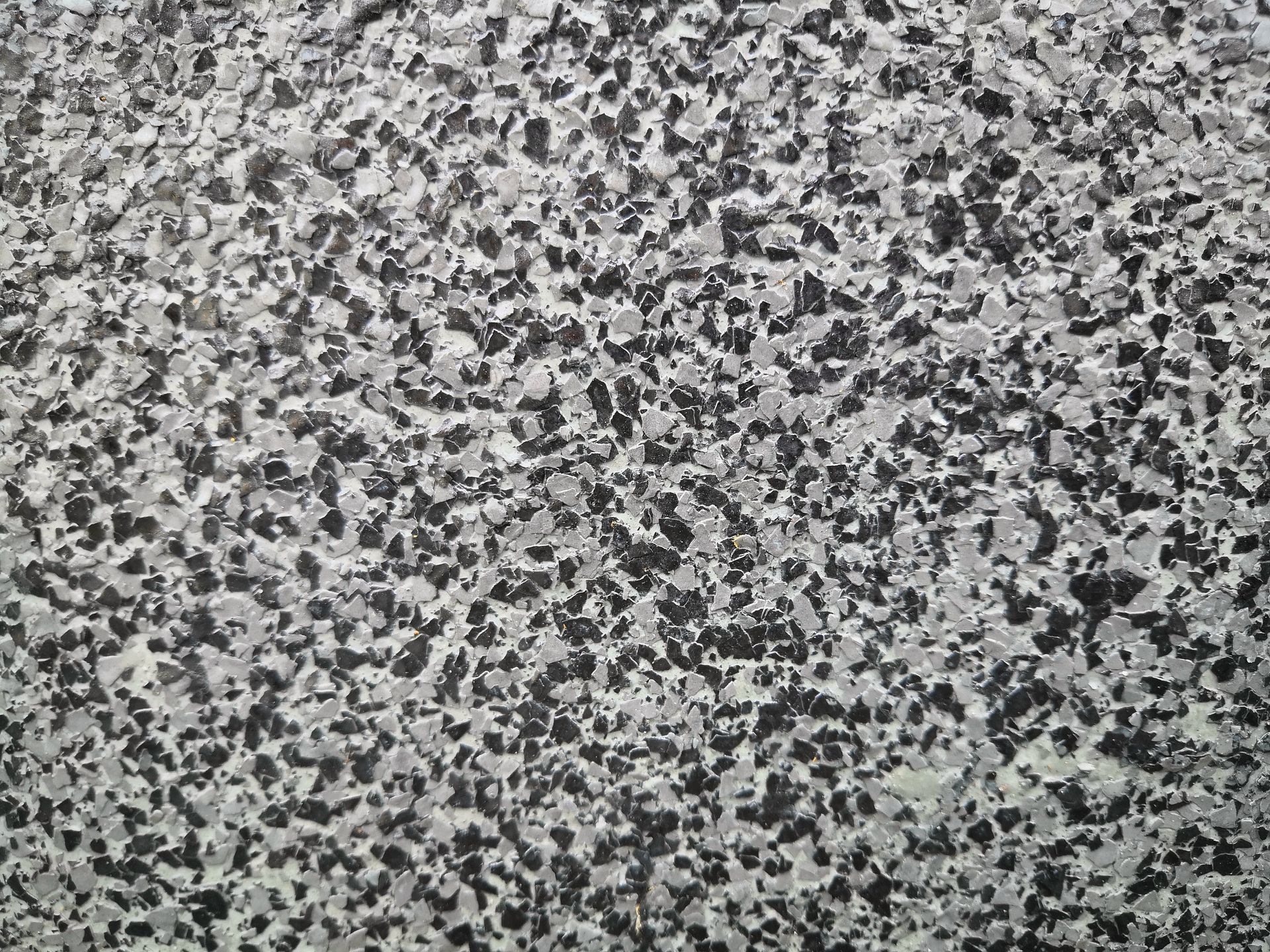 Gray and black speckled stone surface texture