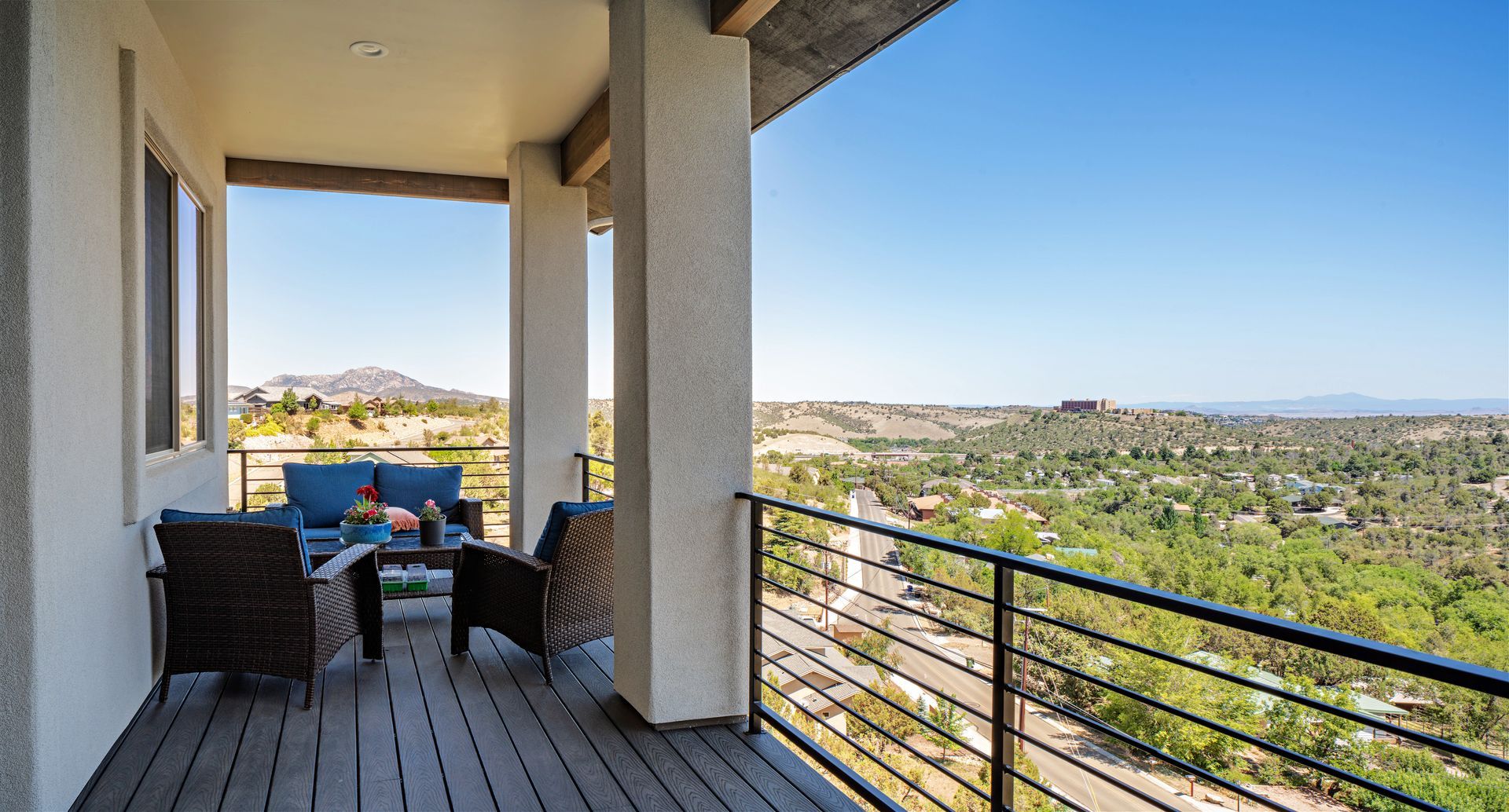 Scenic patio in a custom cliffside home on Jordin Drive in Prescott, AZ, offering breathtaking views and a seamless connection to the natural landscape