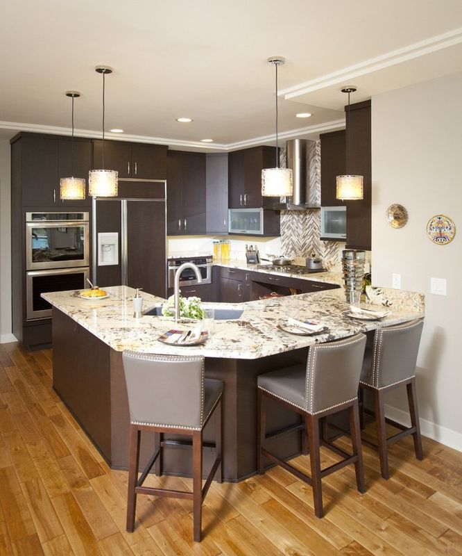 A kitchen with a large island and stools