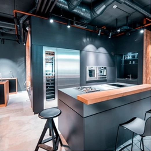 A kitchen with a large island and stools