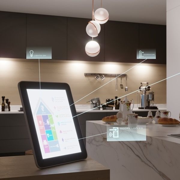 A tablet is sitting on a counter in a kitchen