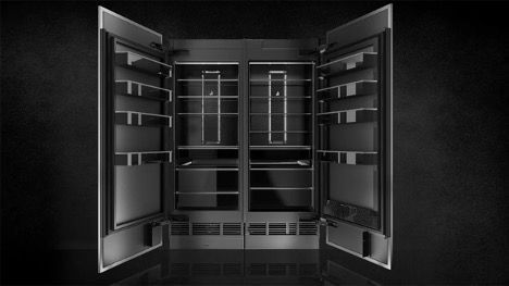 A black and white photo of a refrigerator with the doors open