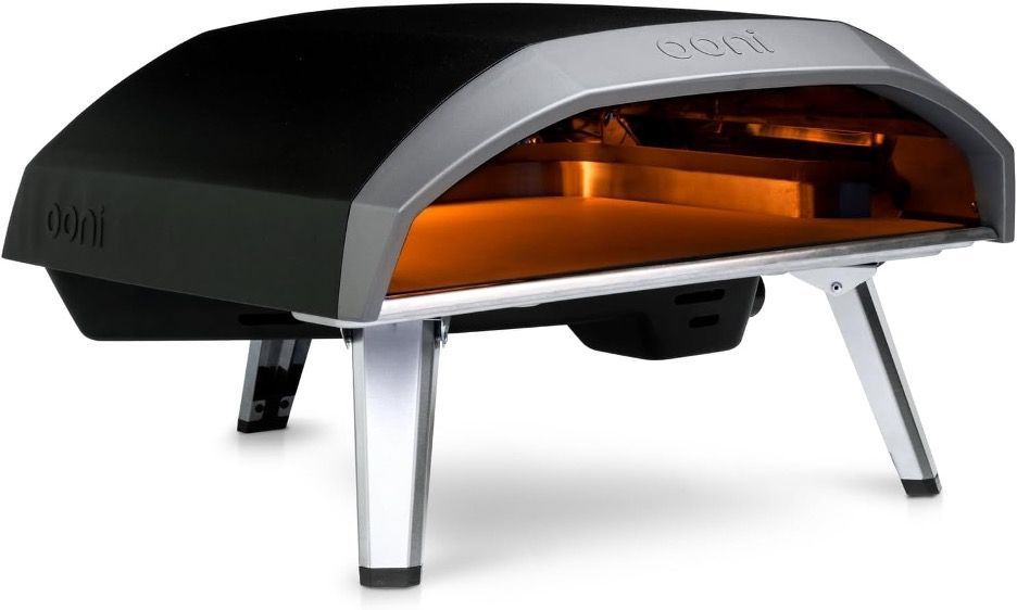 A black and silver pizza oven is sitting on a white surface.