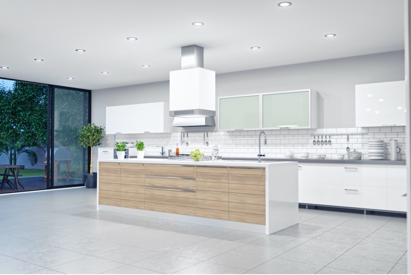 A modern kitchen with white cabinets and a large island in the middle.