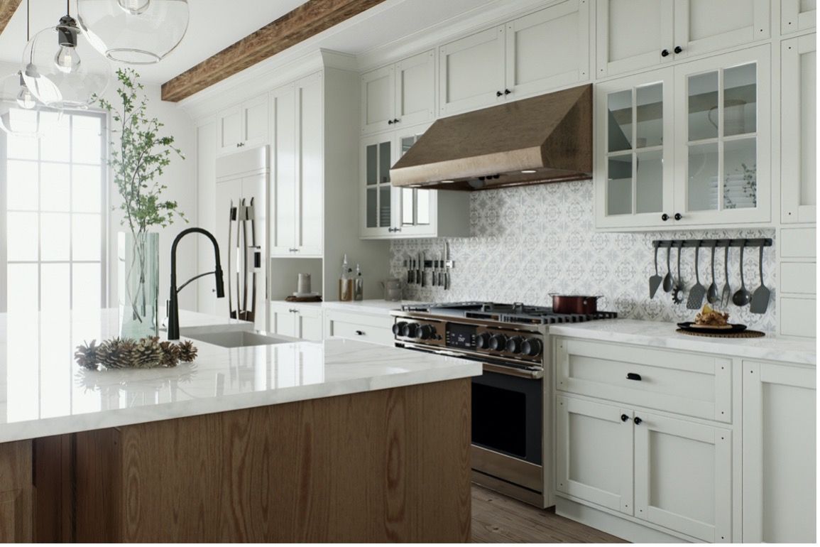 A kitchen with white cabinets , stainless steel appliances , and a large island.