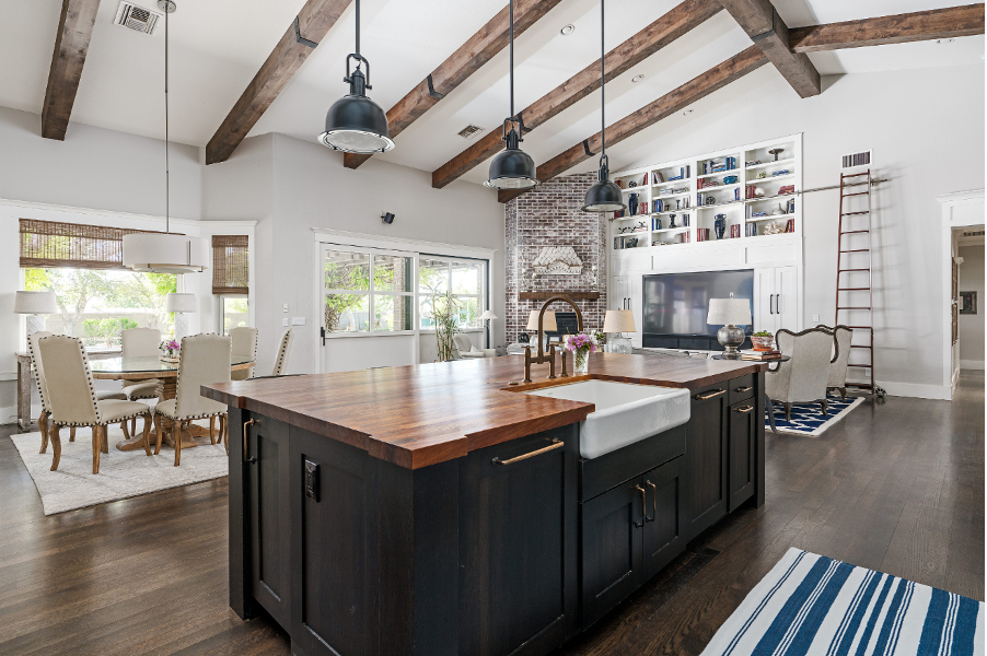 A kitchen with a large island and a sink.