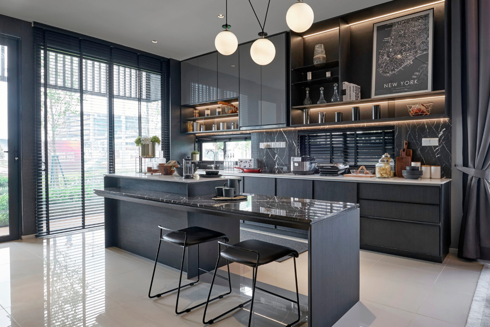 A modern kitchen with a large island and stools.