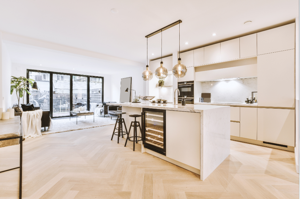 A kitchen with a large island in the middle of the room.
