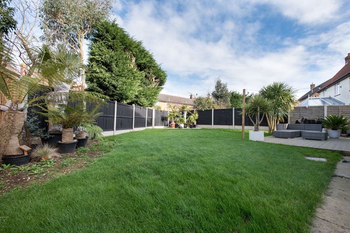 A Lush Green Backyard with A Fence and Lots of Trees - Kinston, NC - Garden Gator Landscape & Design