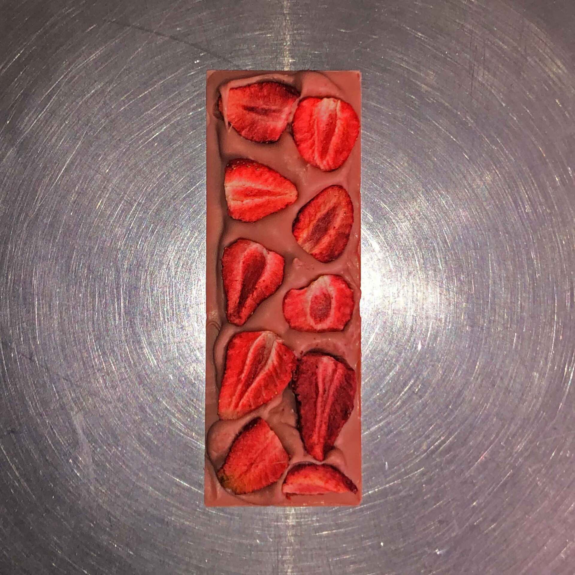 Strawberry infused white chocolate bar with freeze dried strawberry pieces