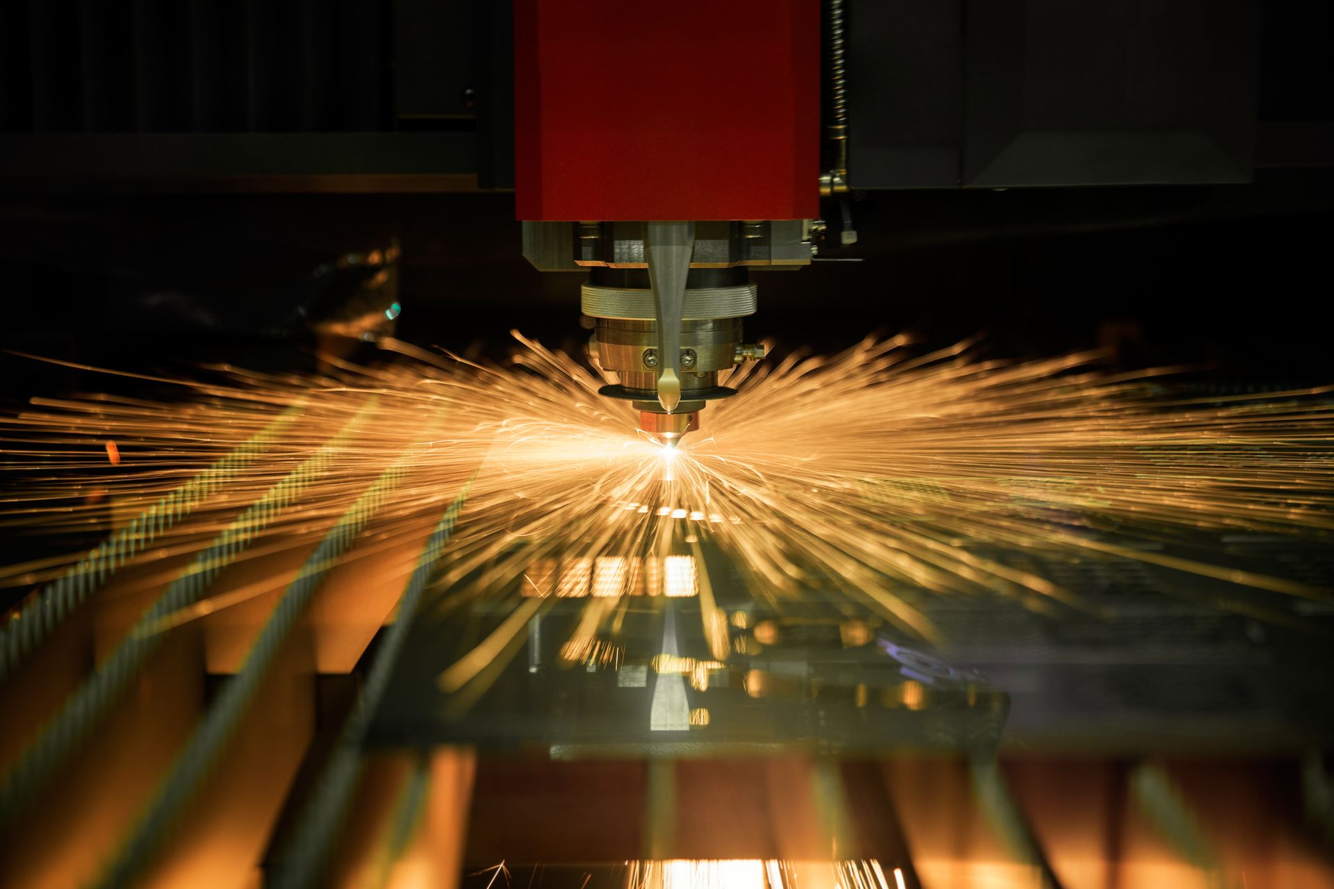 Laser Cutter in Operation, Emitting Bright Sparks and Light — Bryants Laser Works in Brisbane, QLD