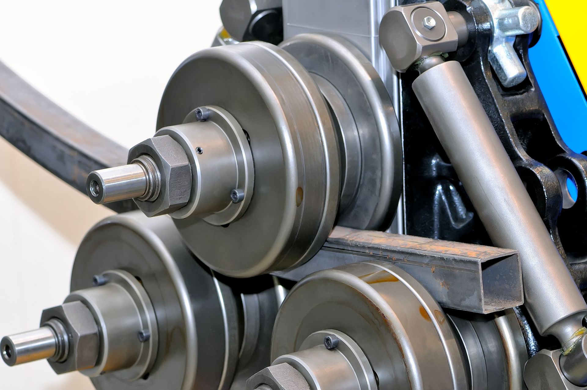 Metal Rolling Machine Shaping a Square Metal Tube — Bryants Laser Works in Ipswich, QLD