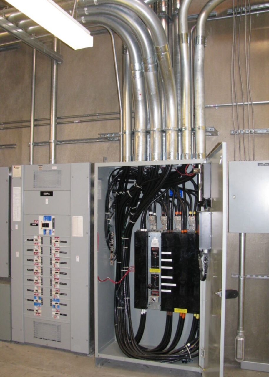 Commercial main electrical distribution panel with conduit runs and sub-panel wiring in Woodstock Georgia